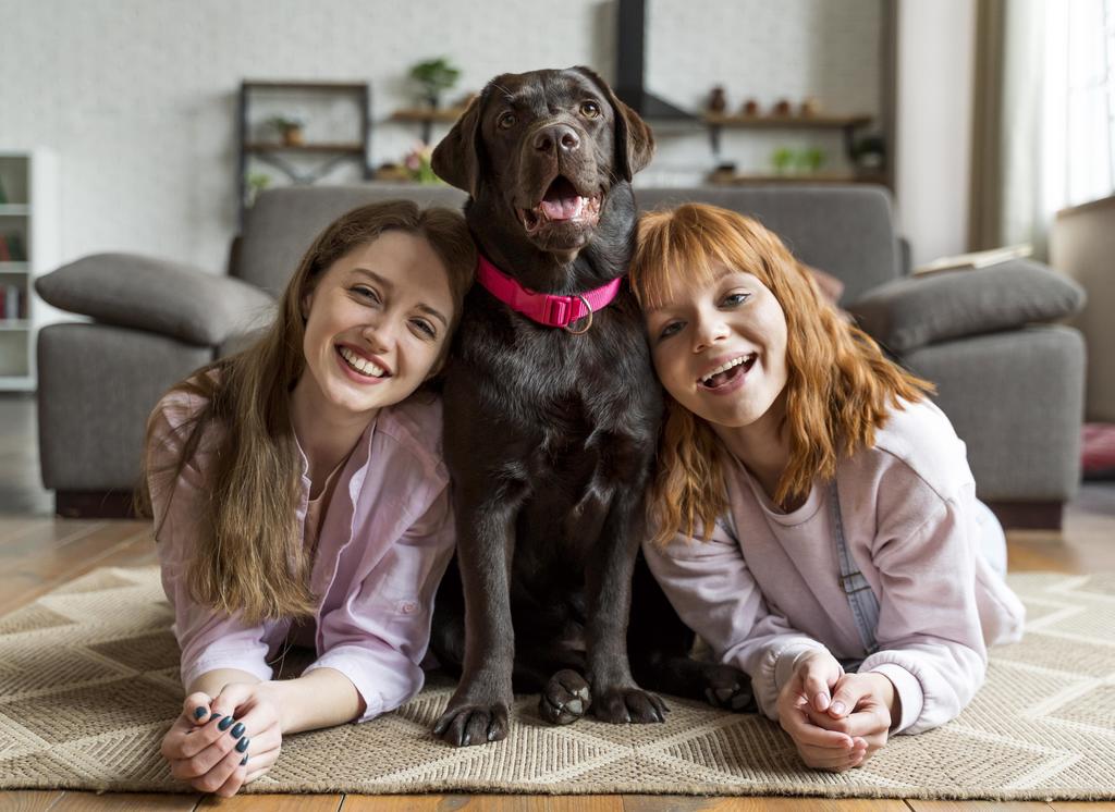 Dog and children posing