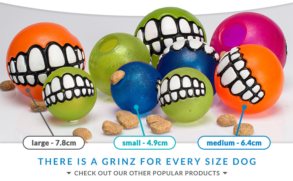 Rogz Grinz Treat Ball Red alongside a collection of other vibrant colored balls, offering a variety of options for interactive play and mental stimulation