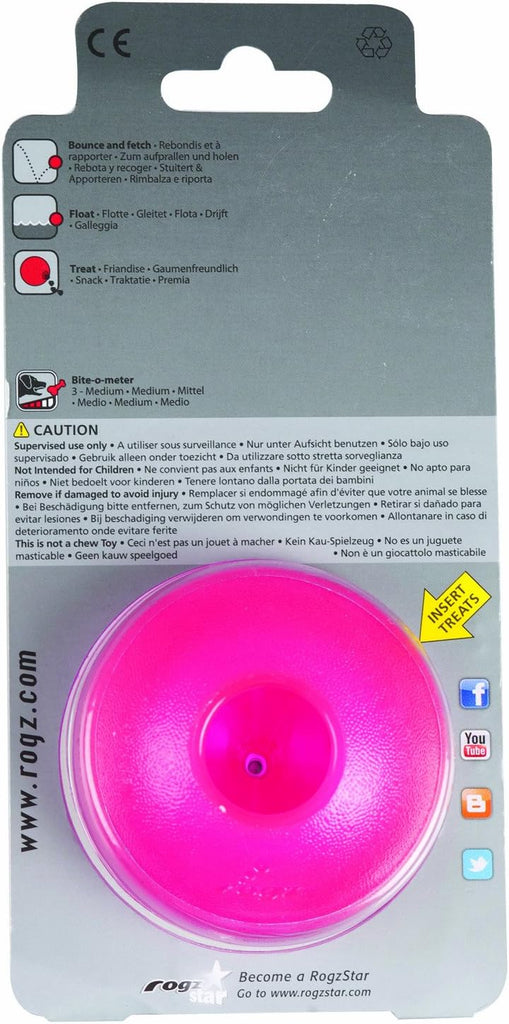 Rogz Grinz Treat Ball Pink placed in a backpack, demonstrating its portability and convenience for on-the-go pet owners.