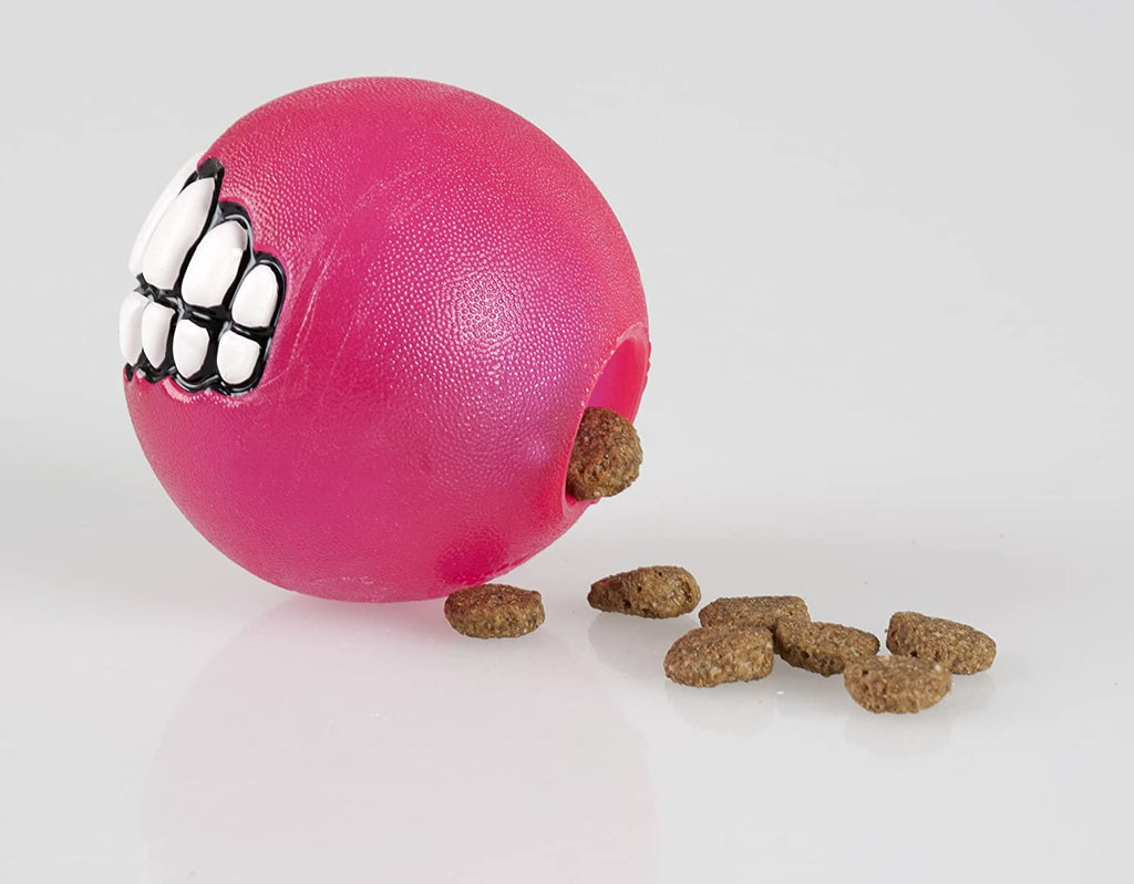 Rogz Grinz Treat Ball Pink filled with delicious treats, emphasizing its purpose as a treat-dispensing toy.
